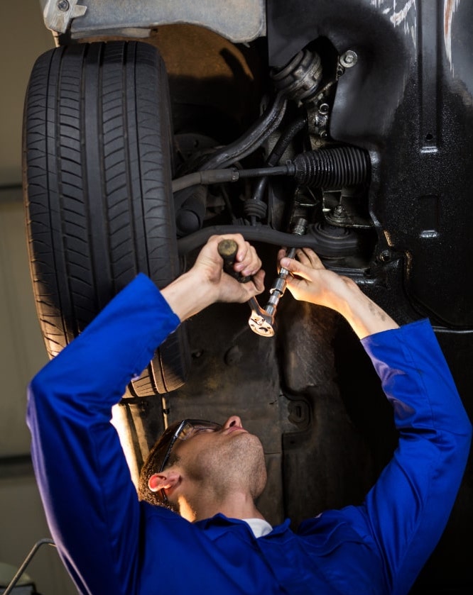 mechanic-servicing-car-min